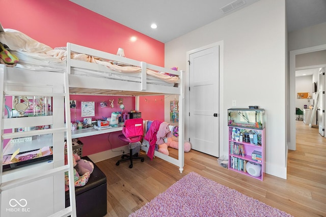 bedroom with recessed lighting, baseboards, visible vents, and wood finished floors