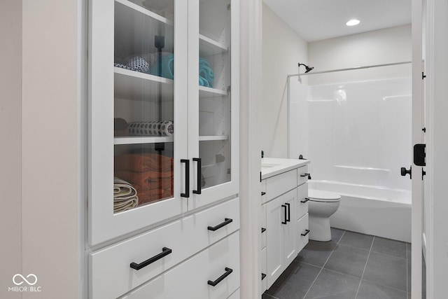 bathroom featuring vanity, toilet, tile patterned floors, recessed lighting, and  shower combination