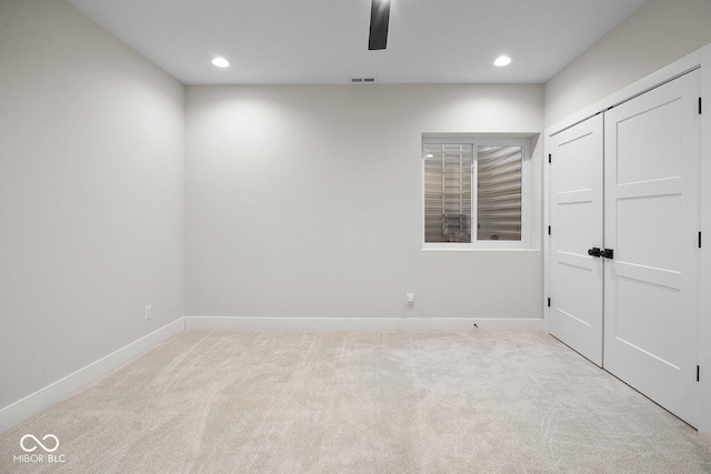 unfurnished bedroom with carpet floors, baseboards, and visible vents