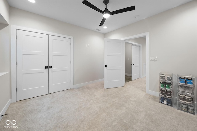 carpeted bedroom featuring baseboards, recessed lighting, visible vents, and a closet