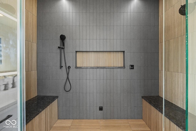 bathroom featuring a tile shower