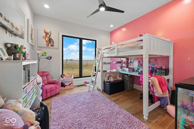 bedroom with recessed lighting, a ceiling fan, and wood finished floors