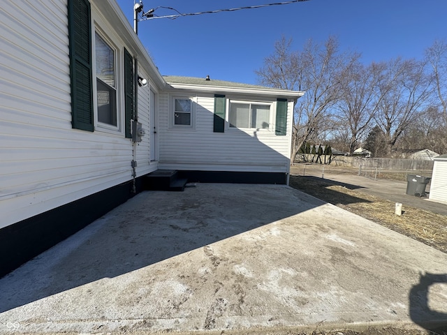 view of side of property with fence