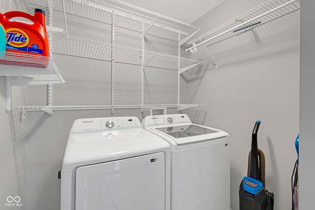 laundry area featuring laundry area and washing machine and clothes dryer