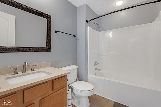 full bathroom with toilet, tub / shower combination, a textured ceiling, vanity, and tile patterned floors