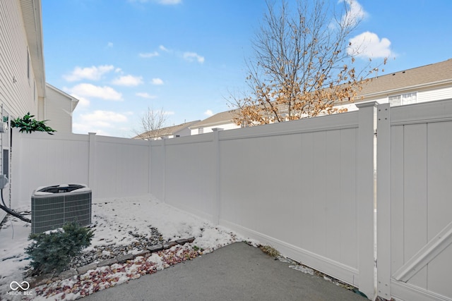 view of patio with central AC unit and a fenced backyard