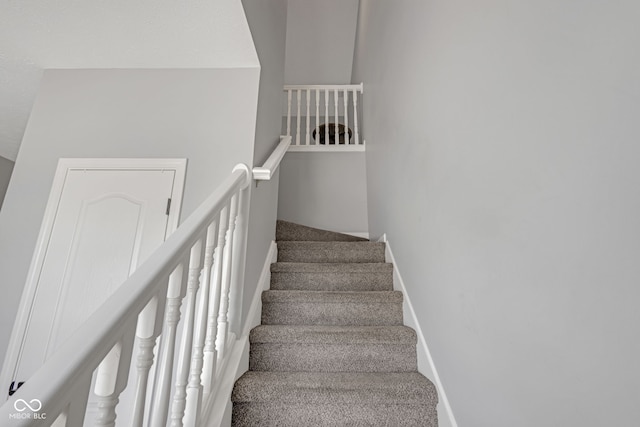 stairs featuring baseboards