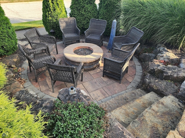 view of patio with an outdoor fire pit