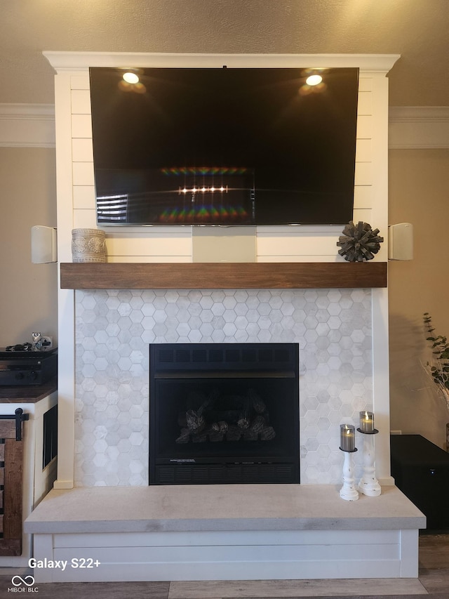 details with ornamental molding and a fireplace