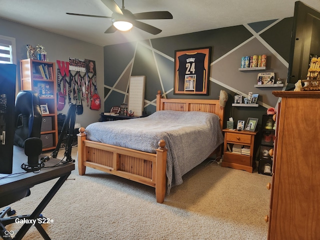 bedroom with a ceiling fan and carpet flooring