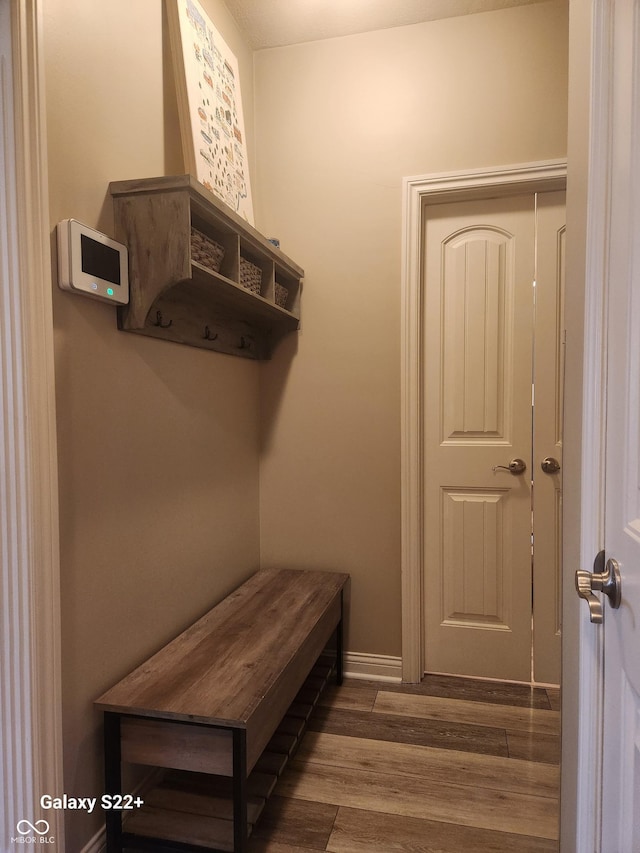 mudroom with baseboards and wood finished floors