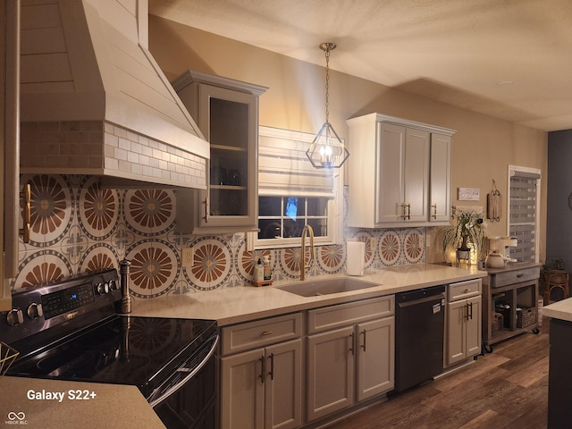 kitchen with dishwasher, a sink, stainless steel range with electric cooktop, premium range hood, and backsplash