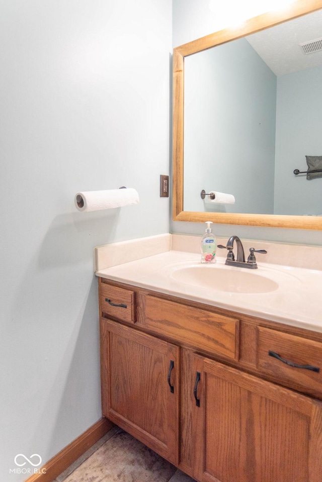 bathroom with vanity and visible vents