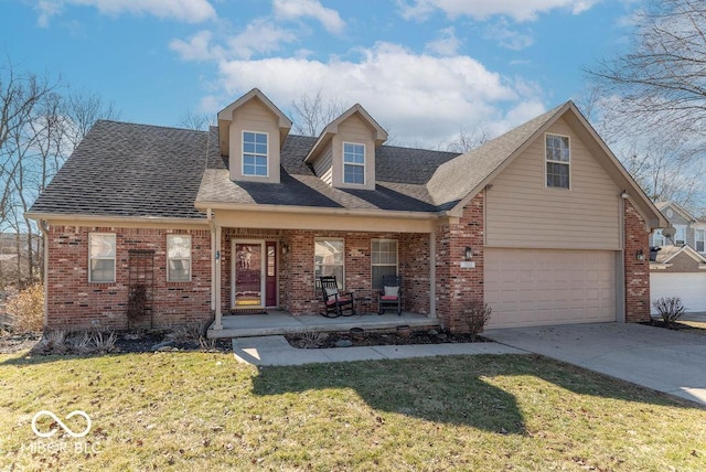 new england style home with driveway, brick siding, an attached garage, a porch, and a front yard