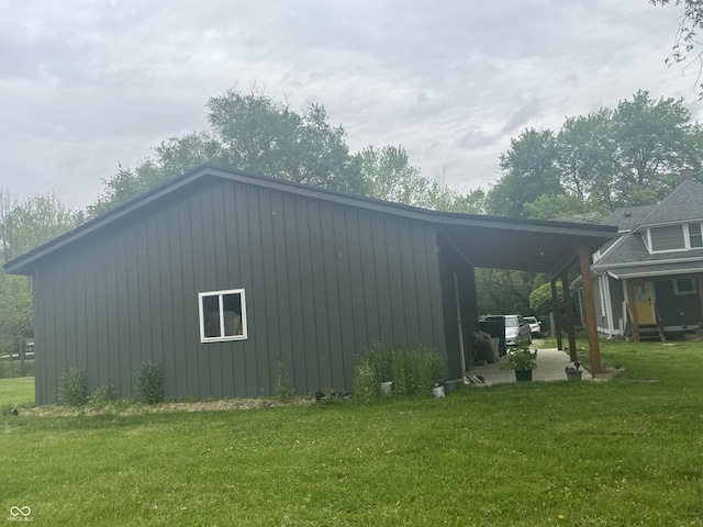 5533 Wilson Way, Jamestown, IN 46147 - view of side of home with a lawn, board and batten siding, and a carport