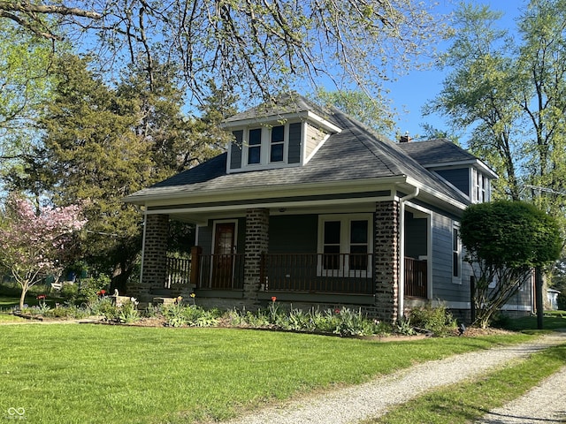 5533 Wilson Way, Jamestown, IN 46147 - bungalow-style home with a porch, a front lawn, brick siding, and a shingled roof