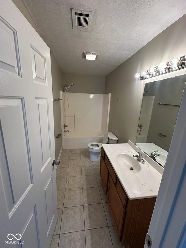 full bath with a textured ceiling, visible vents, tile patterned flooring, vanity, and toilet