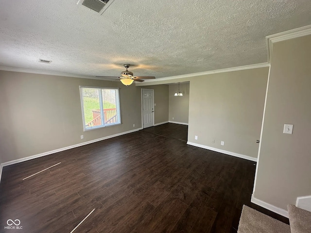 spare room with ceiling fan, dark wood-type flooring, a textured ceiling, and visible vents