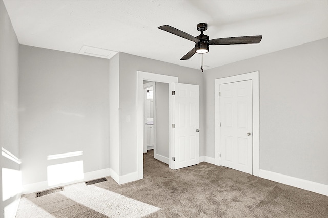 unfurnished bedroom featuring baseboards, visible vents, and carpet flooring