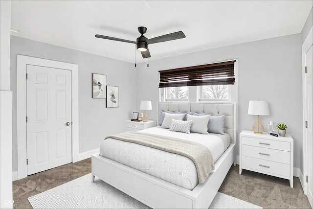 bedroom with light carpet, a ceiling fan, and baseboards