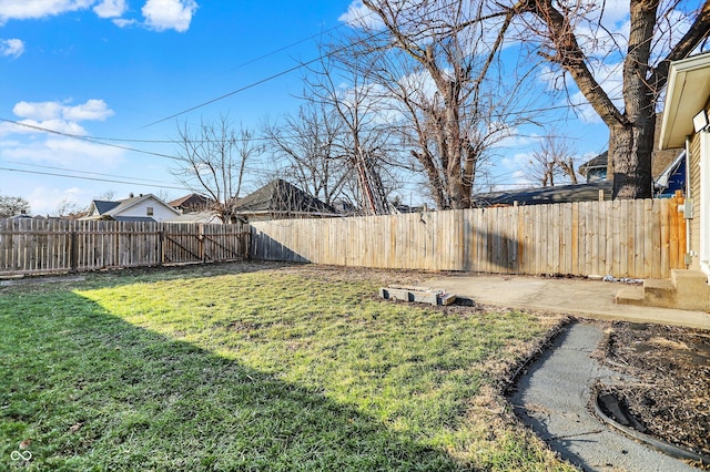 view of yard with a fenced backyard