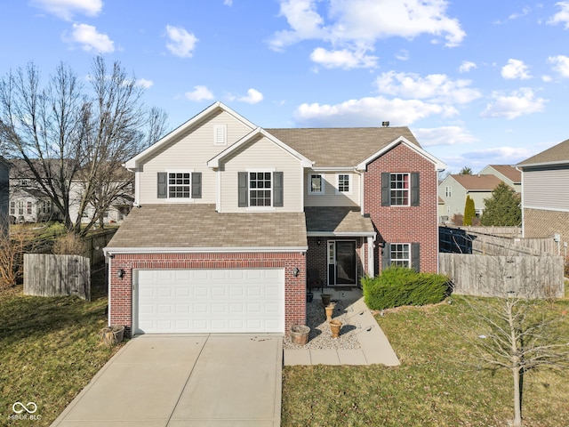 traditional-style house featuring an attached garage, brick siding, fence, concrete driveway, and a front yard