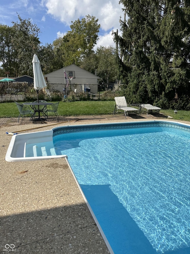 pool with a patio