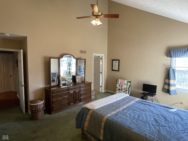 carpeted bedroom with visible vents, high vaulted ceiling, and ceiling fan