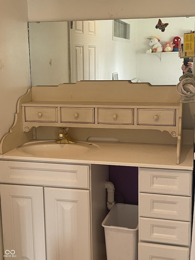 bathroom featuring visible vents and vanity