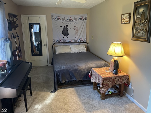 carpeted bedroom with baseboards