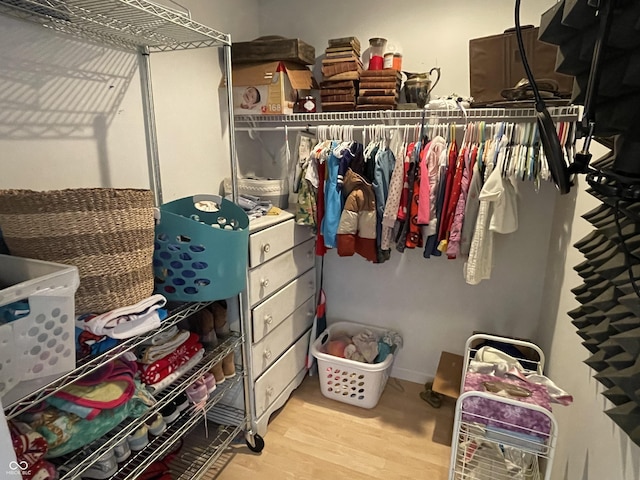 spacious closet with light wood-style floors