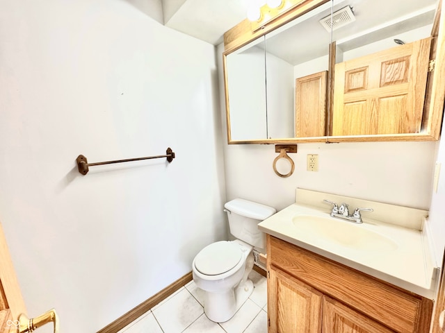 half bathroom with visible vents, toilet, vanity, tile patterned flooring, and baseboards