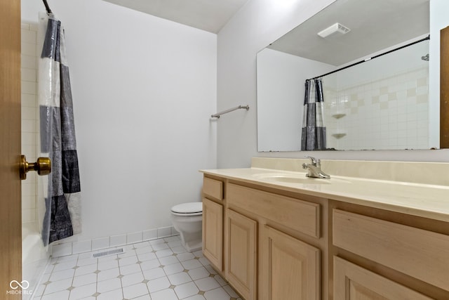 bathroom featuring baseboards, visible vents, vanity, and toilet