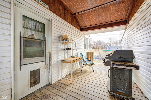 wooden deck with grilling area