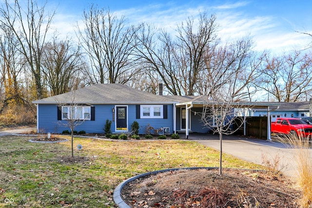 ranch-style house featuring driveway, a chimney, a front lawn, and a carport