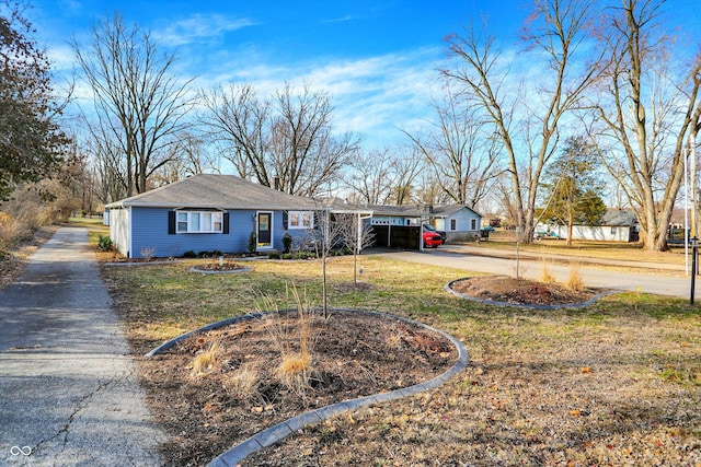 ranch-style house with a front yard and driveway