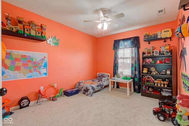 bedroom with ceiling fan, carpet, visible vents, and baseboards