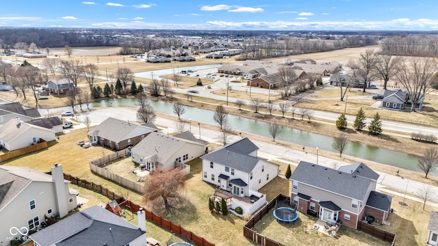 bird's eye view with a water view and a residential view