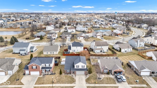 aerial view featuring a water view and a residential view