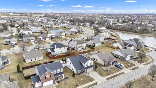 birds eye view of property featuring a residential view and a water view