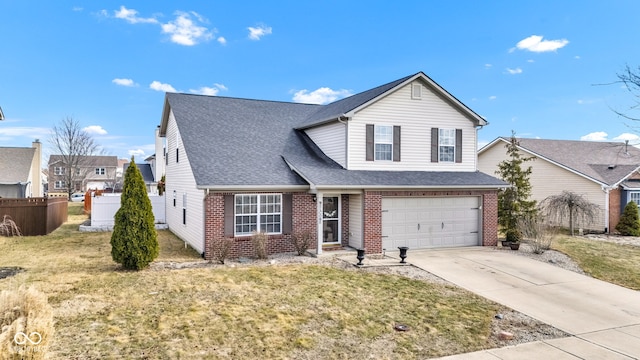 traditional home featuring an attached garage, fence, concrete driveway, and brick siding