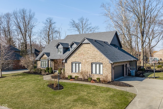 view of front facade featuring brick siding, a front yard, roof with shingles, a garage, and driveway