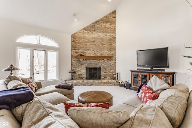 carpeted living area with high vaulted ceiling and a fireplace