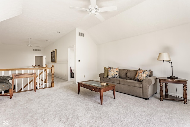 carpeted living area featuring visible vents, ceiling fan, and vaulted ceiling