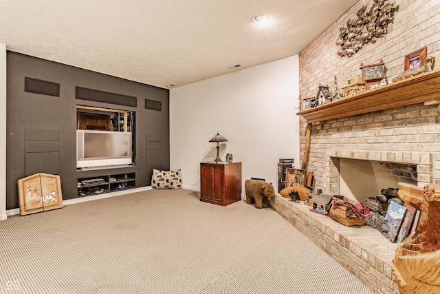 carpeted living area featuring visible vents, baseboards, a textured ceiling, and a brick fireplace