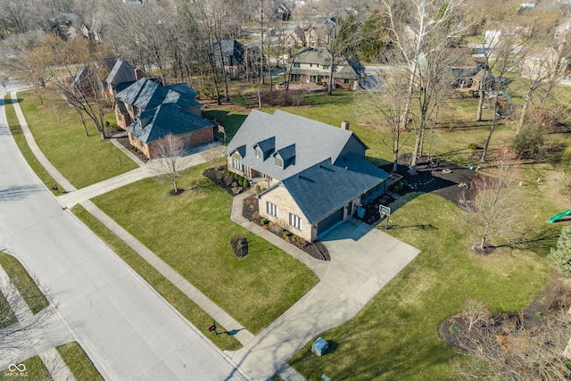 birds eye view of property with a residential view