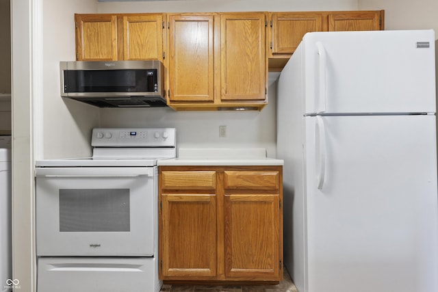 kitchen featuring white appliances and light countertops