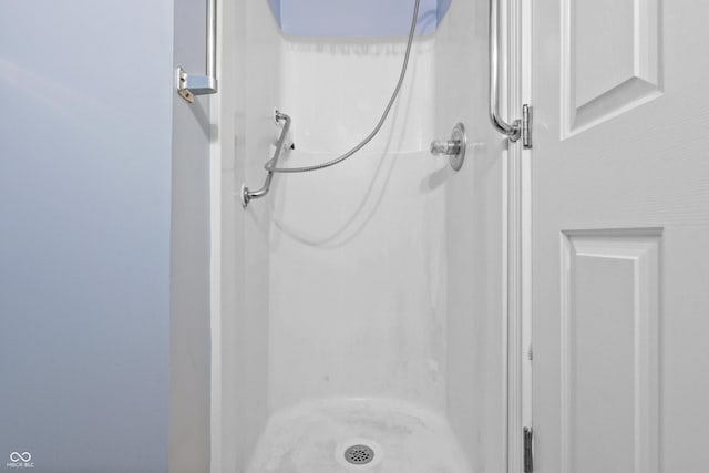 full bathroom with a shower stall