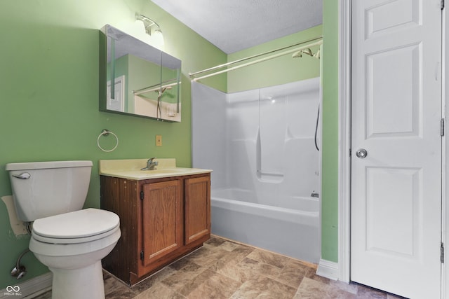 full bath featuring shower / bathing tub combination, vanity, toilet, and a textured ceiling