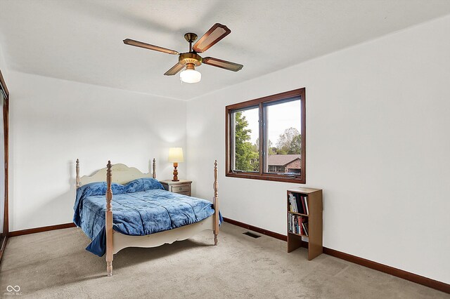 211 Deborah Ln, Whiteland, IN 46184 - bedroom with light carpet, baseboards, and ceiling fan